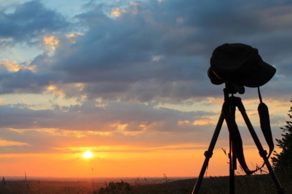 Camera on a tripod at sunset