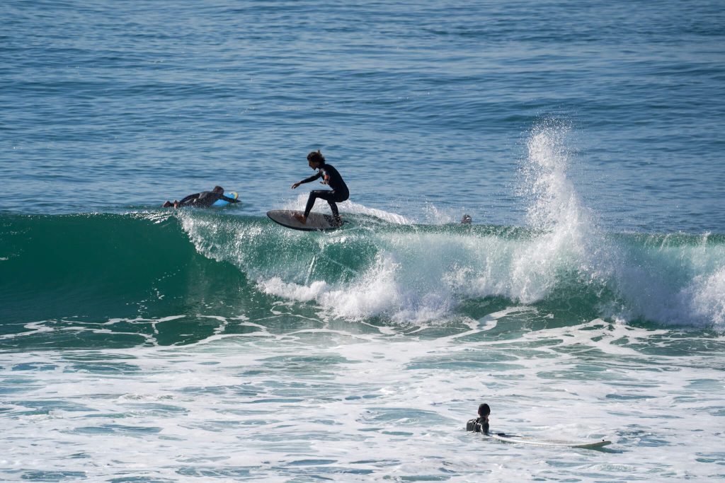 Moroccain surfer in big green wave